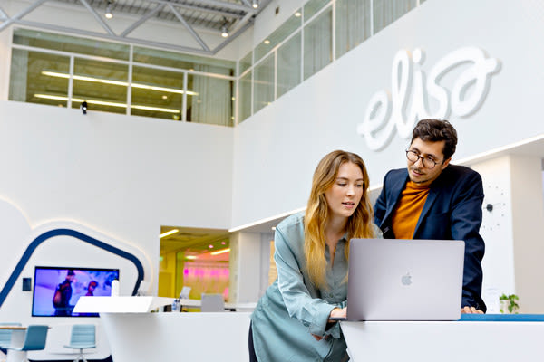 Two people at Elisa office